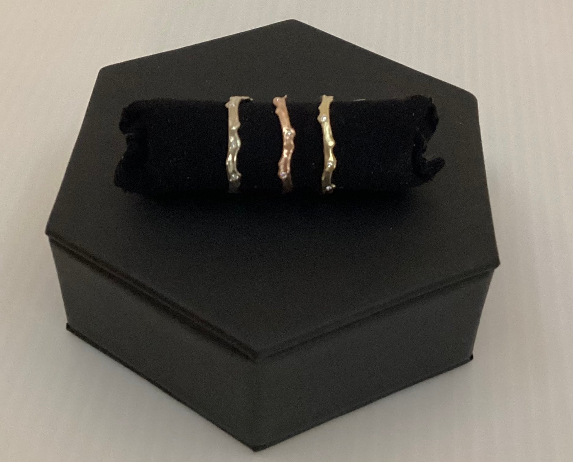 Coral stick ring with scattered diamonds