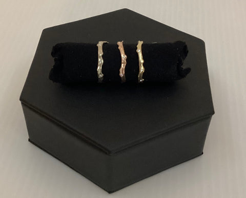 Coral stick ring with scattered diamonds