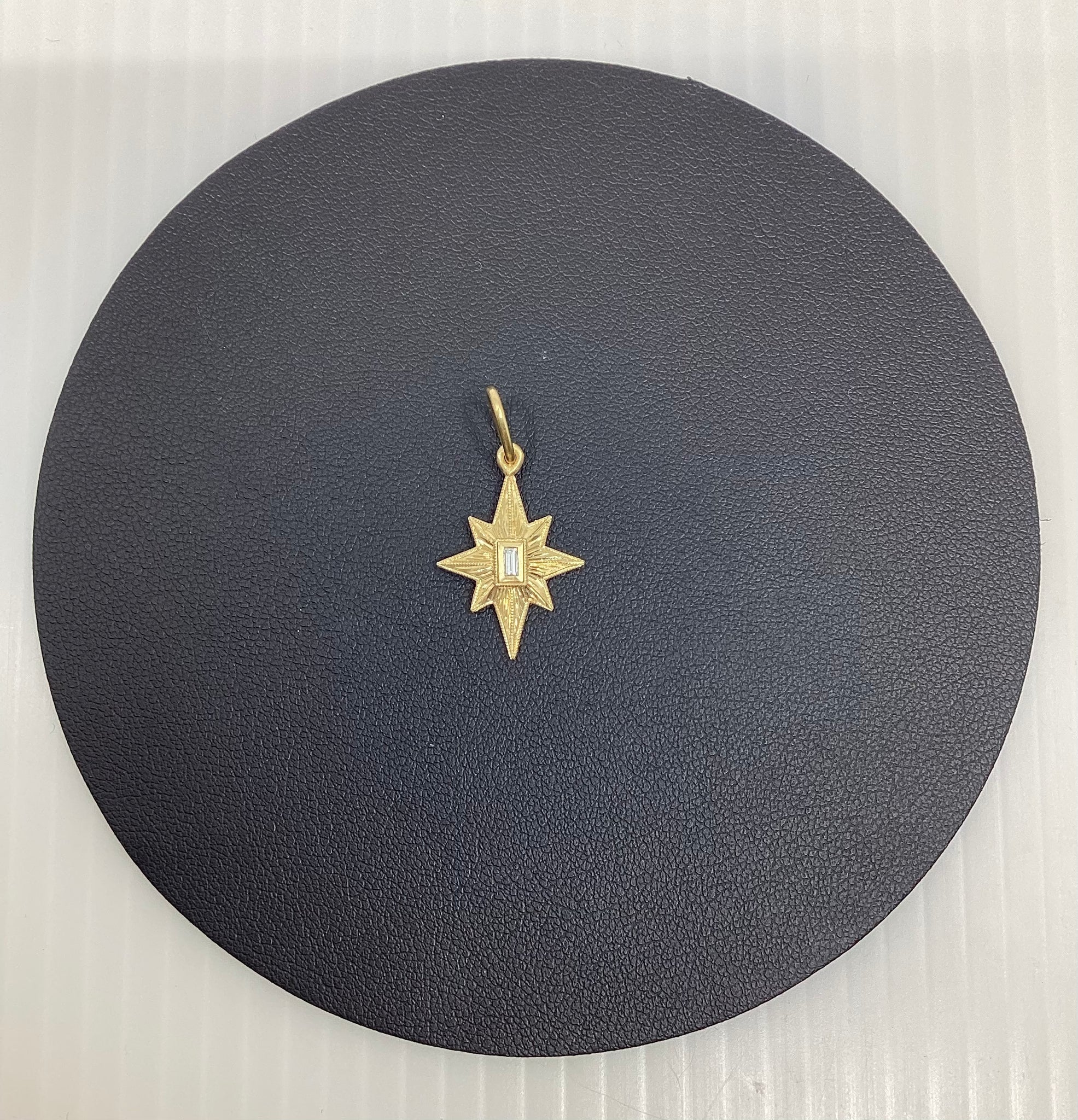 Erica Molinari Gold star with diamond baguette